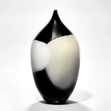 rounded tall oval bottle sculpture with long narrow pointed neck with abstract blob pattern like a rothko painting in black white and cream hand blown from glass