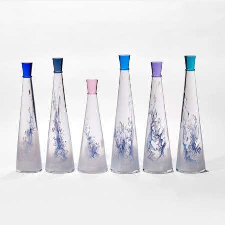 set of six conical tall bottles with fading interior from white to clear and blue lined helix detail each with a different coloured stopper hand made form glass