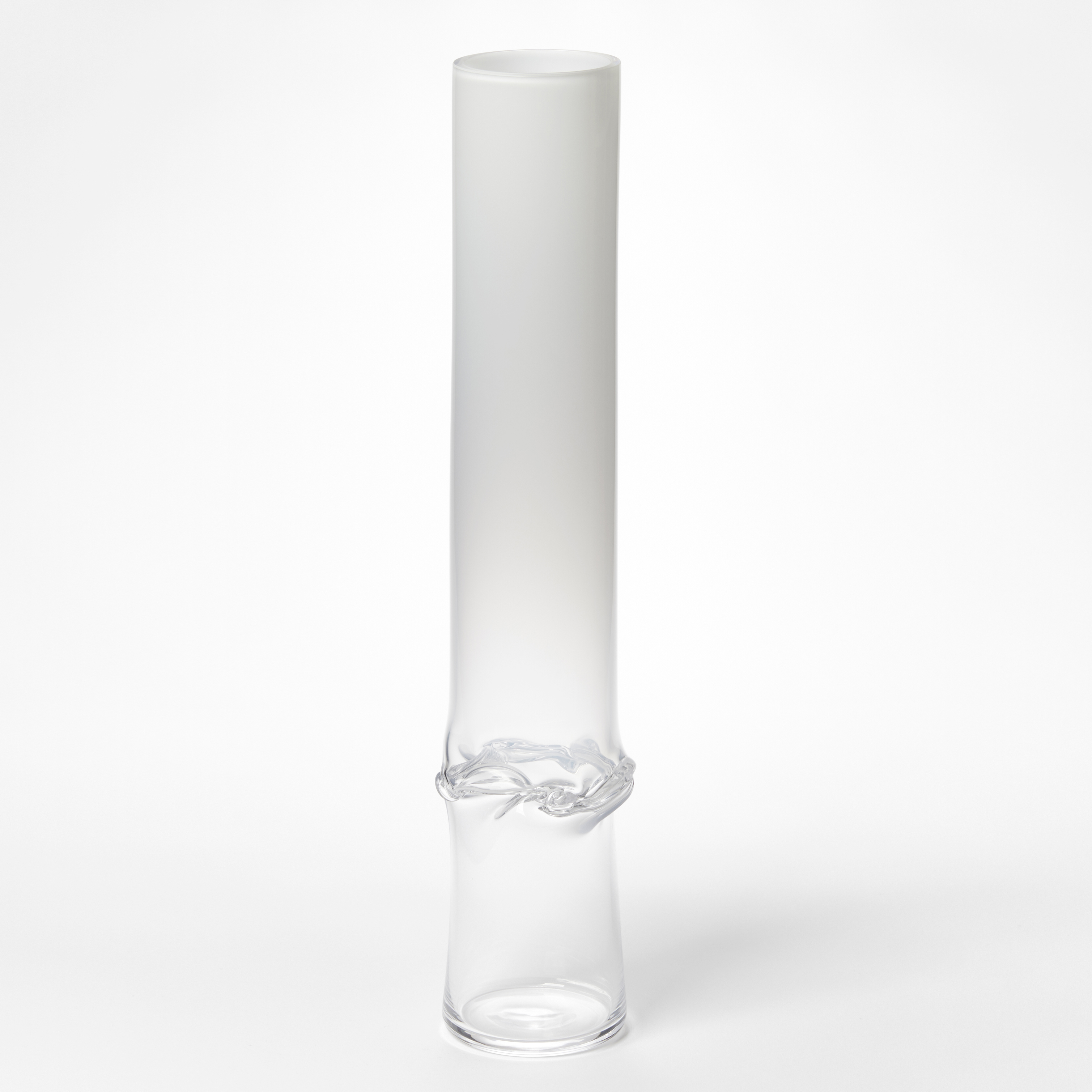 hand made glass sculptural cylinder with clear base fading to opaque white with dividing wrinkled and rippled waist section