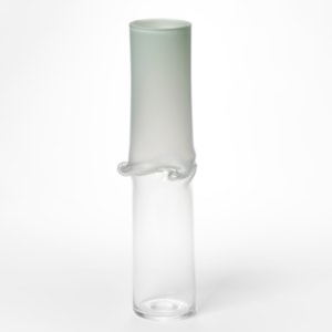tall cylinder with transparent clear bottom half and opaque celadon green top half with central creased and slumped rippling and bulging waist hand made from glass