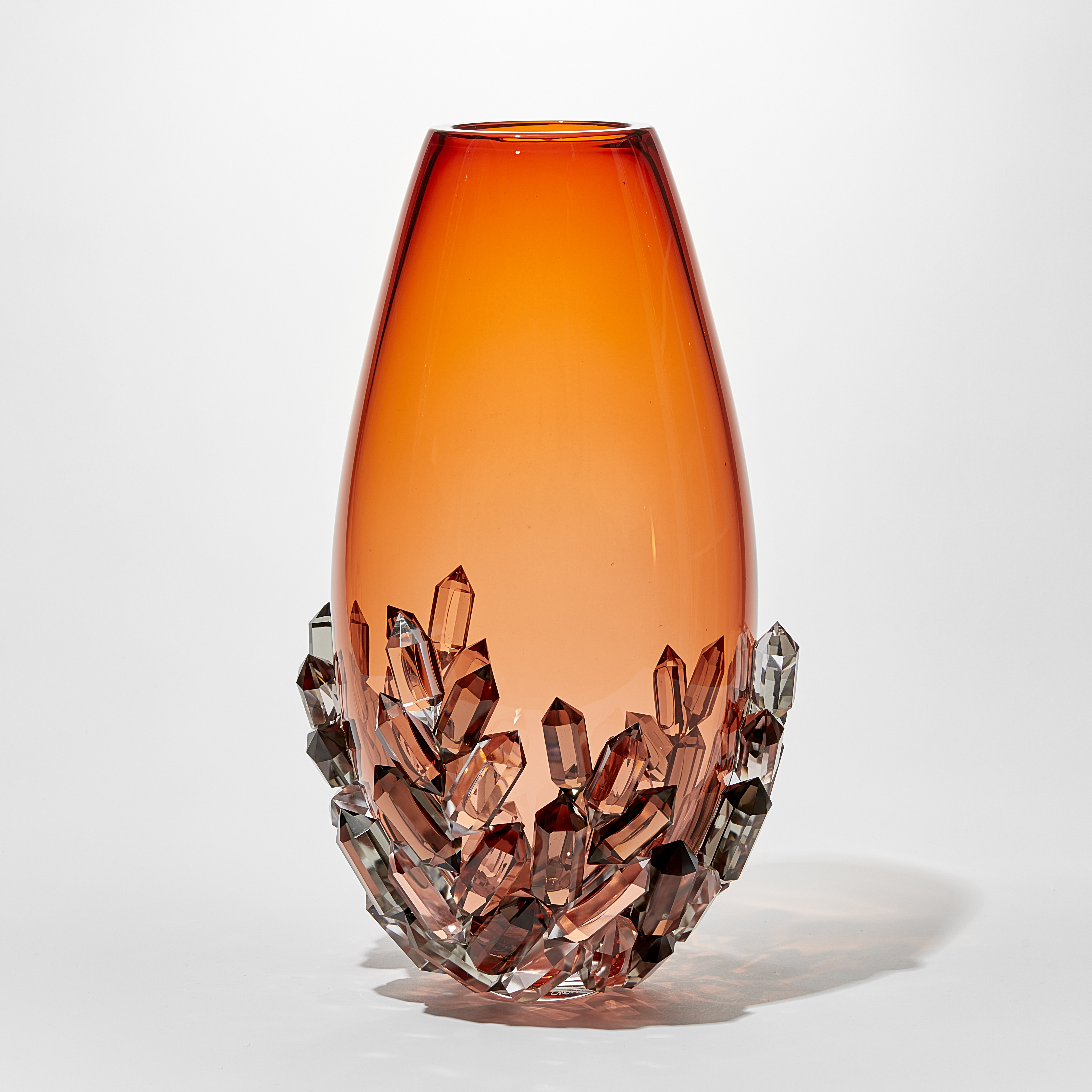 elegant ovoid teardrop shaped transparent rich peachy orange vase with lover third outside covered in cut crystals in clear grey and peach handblown and cut from glass