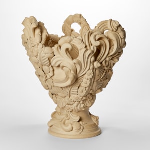 flared light biscuit coloured vase with dramatic architectural swirls flourishes shells and floral details with undulated top edge hand made from white saint thomas clay