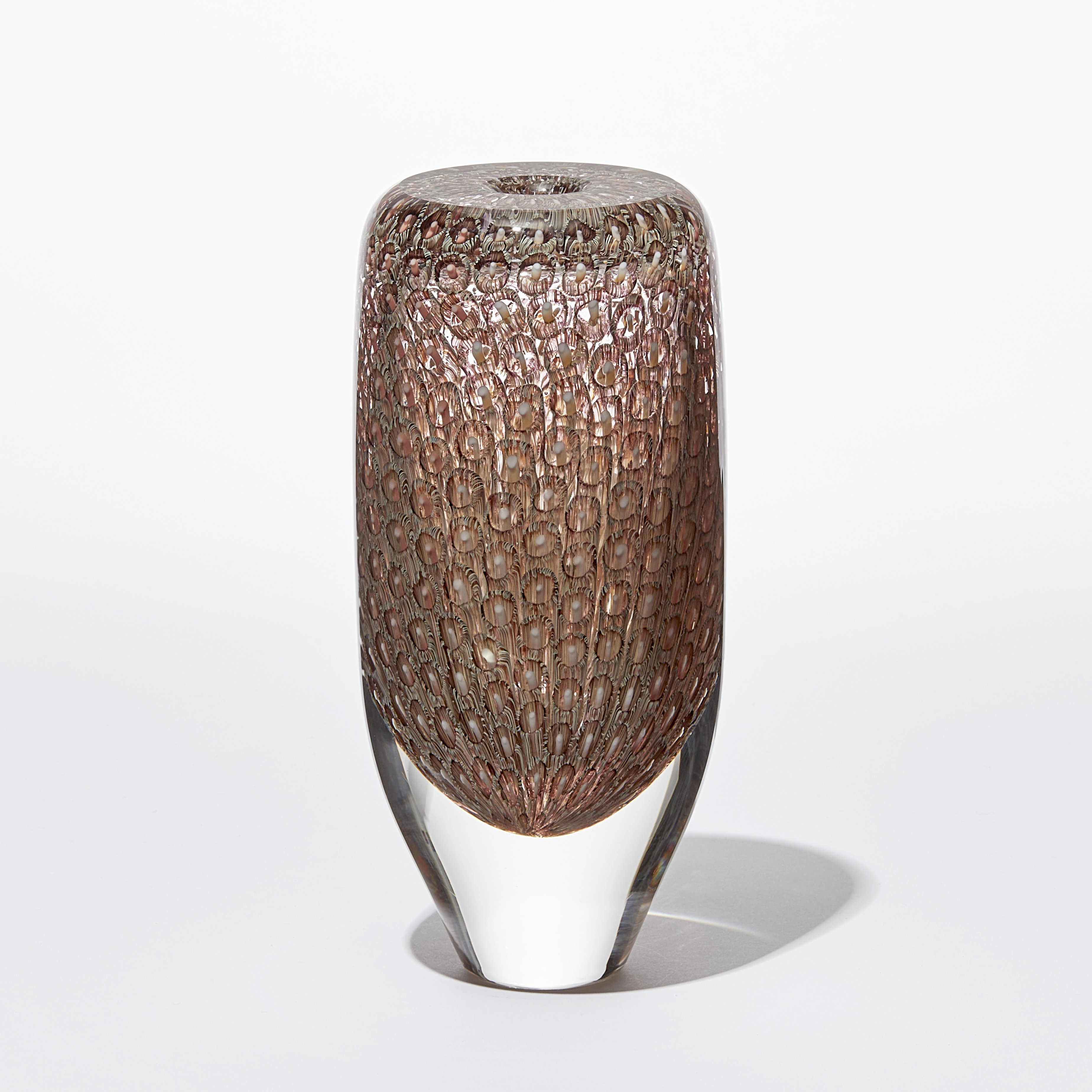 transparent tall round vessel with flat top and small aperture opening with fine repeat surface pattern in aubergine salmon and warm yellow hand made from glass