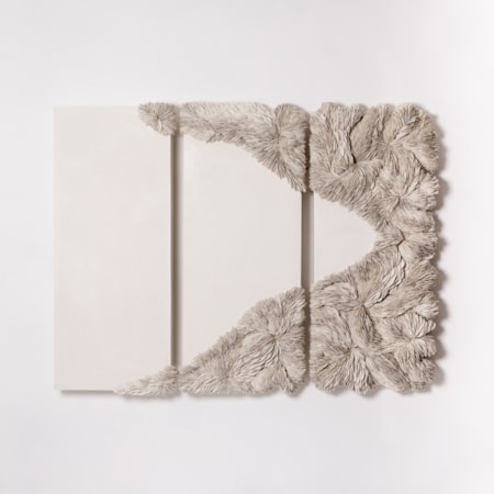 series of three tall rectangular panels with crisp lines in sand colour with creeping raised scaly textured shaped in an organic area traversing across the three with more on the right panel with extended areas top and bottom hand made from porcelain with adelakt plaster