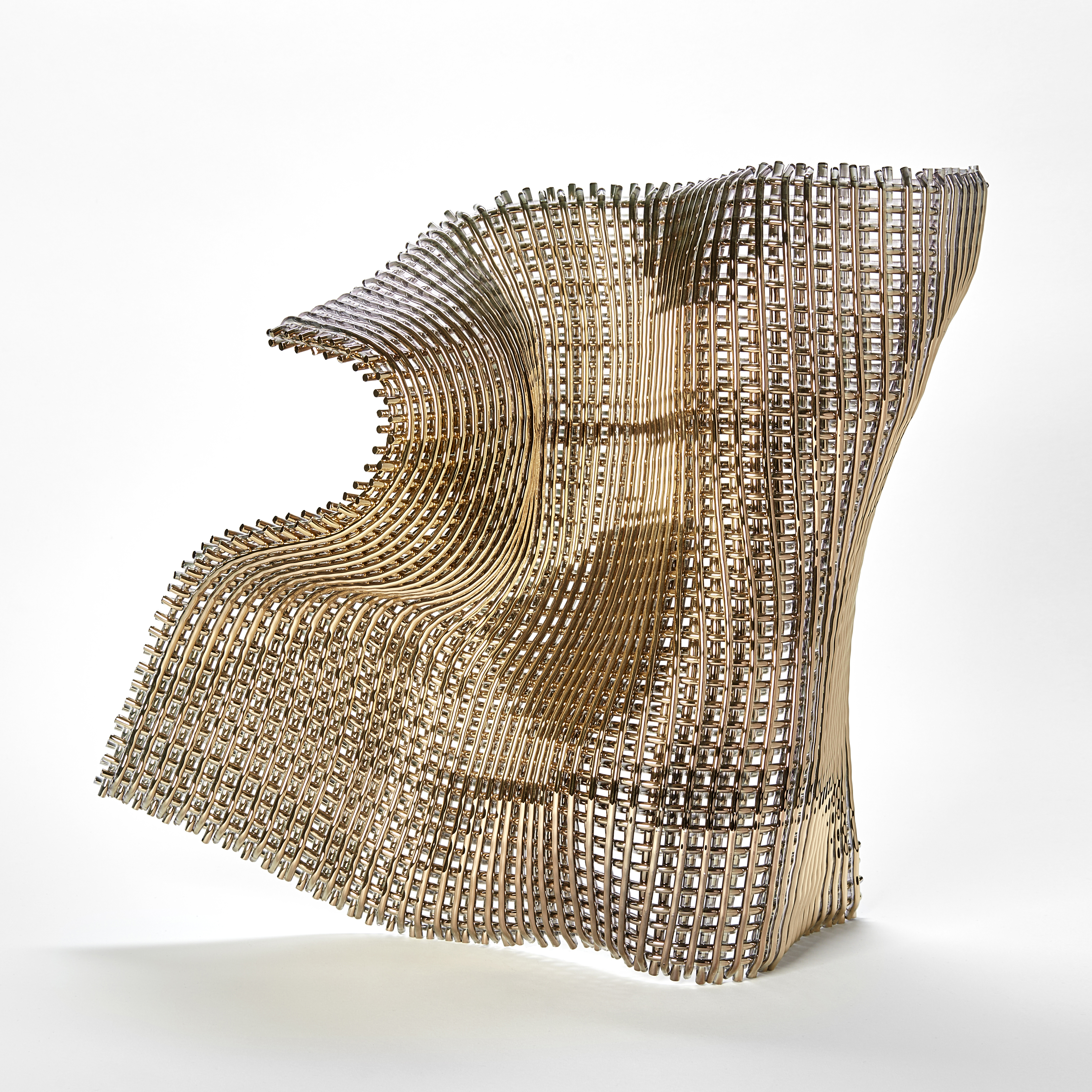 buckled square standing golden woven form with the movement and feel of falling fabric curling and twisting hand made from fused glass