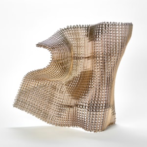 buckled square standing golden woven form with the movement and feel of falling fabric curling and twisting hand made from fused glass