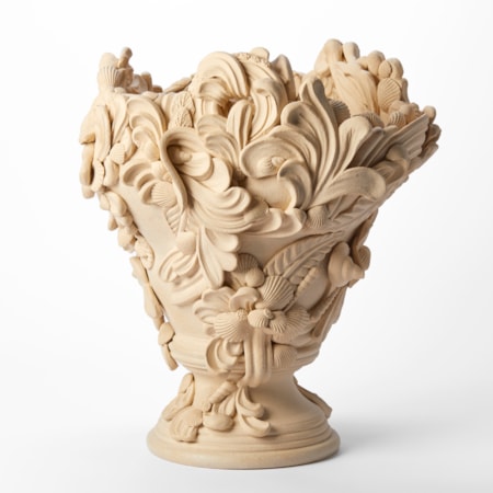 hand throw ceramic centrepiece in soft sand coloured clay with turned foot and covered in flourishes swirls and shells hand made