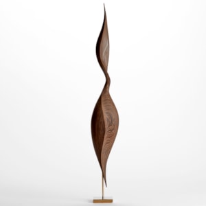 rich dark wenge wood sculpture with swirling dark wood grain and the appearance of an elegant brancusi inspired sleek upright stylised bird with inlaid gold detail and gold plated stand
