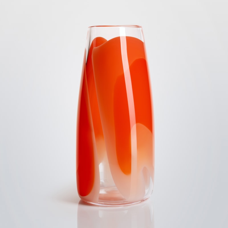 tall soft cylinder vase made from hand blown clear glass with wide soft bands of colour in pink peach orange and red
