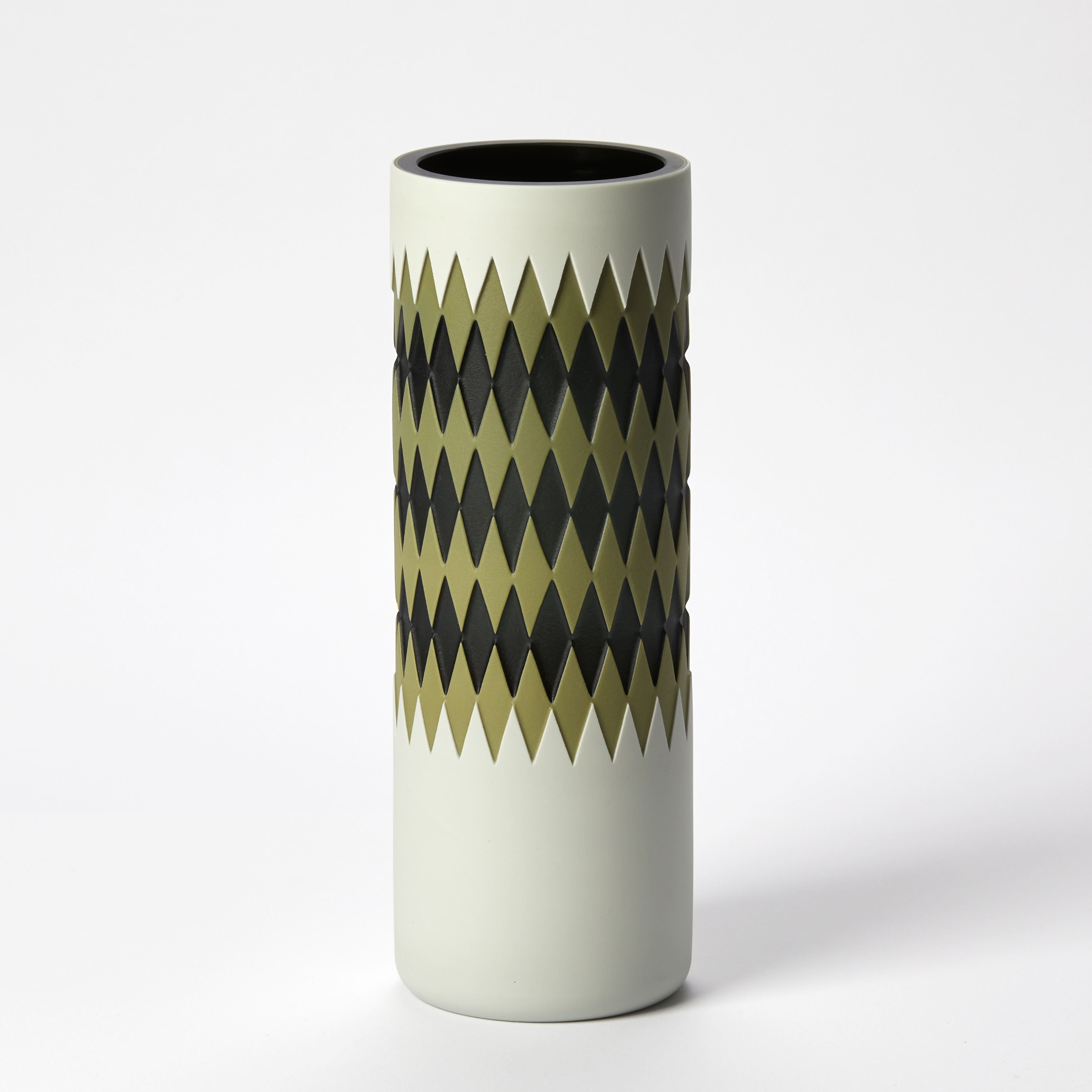 tall tubular opaque vase with an exterior geometric pattern around the form with harlequin diamonds on black and olive green on a white background with a glossy interior hand made from glass