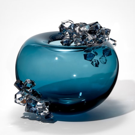 transparent round rich mid blue bubble with top opening and two sections covered in cut clear and blue crystals each with ink swirl details inside handmade from glass