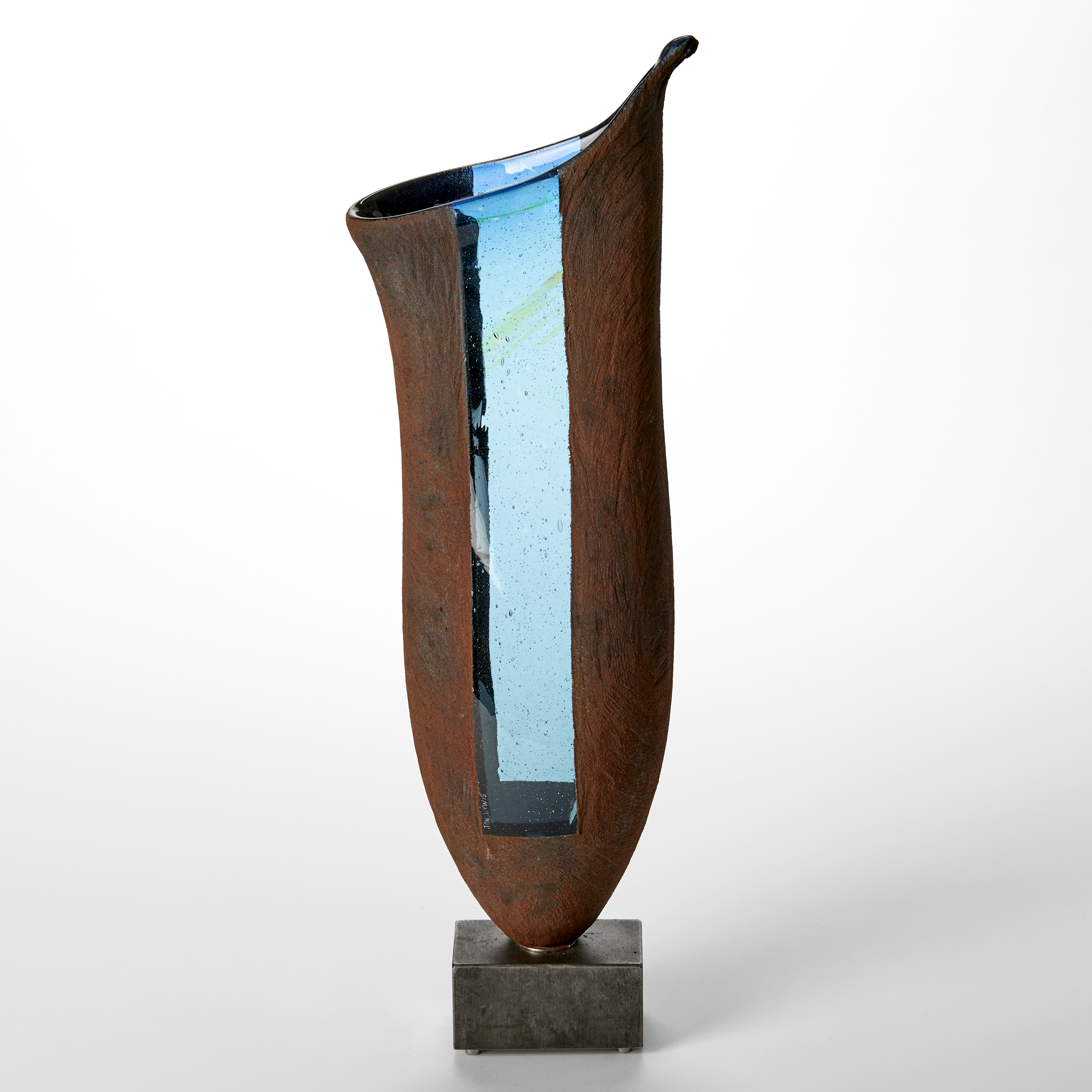 deep rust tall pitcher plant shaped vessel with two transparent rectangular windows in bright blue balanced on a heavy steel base