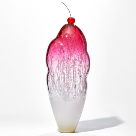 tall and thin decorative glass ornament in white and pink with natural looking internal structure and cherry on top