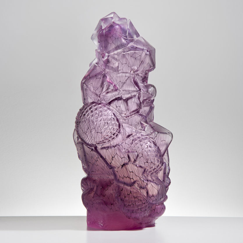pink abstract tall art glass sculpture resembling block of ice