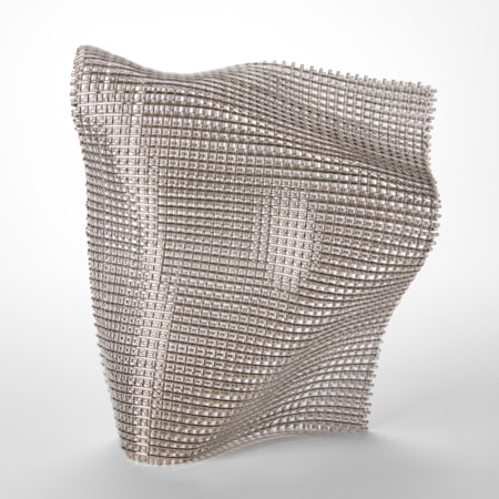 standing silvery shimmering form with the appearance of fabric with folds and subtle undulations hand made from fused glass and nickel chromium