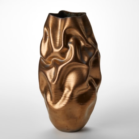 tall wrinkled and creased long oval shaped vase with organically undulating surface and burnished gold finish hand made from clay