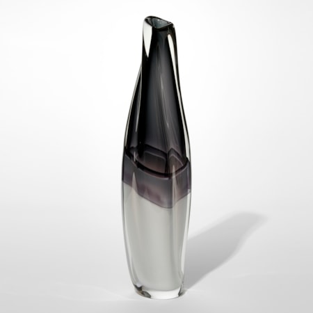 fluid twisting vase with bisected monochrome colouring with the bottom opaque white merging to smokey grey black at the top hand made from glass