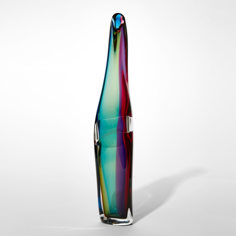 twisting standing vase with fluid lines and merging bands of transparent colour in sea green gold purple and red hand made from blown glass