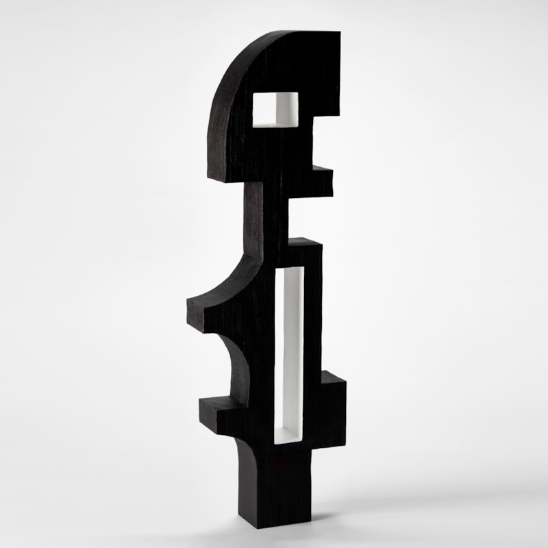 tall black graphic abstract cubist figure with flat front and back with angled and sweeping sides and two cut through rectangular holes with white sides hand made from sapele wood