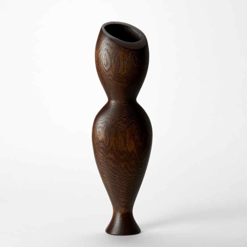 tall hour glass curved standing abstract figurative sculpture with tapered elegant food hand made from oak with a top angled wide opening