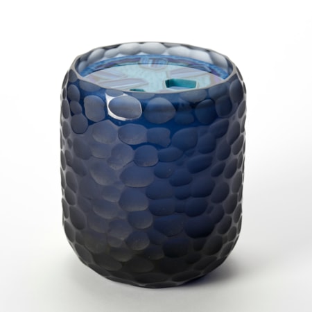 stumpy tubular opaque vessel in dark midnight blue with organic randomly scalloped outer surface and top round opening with an inset disc shaped lid with a polished surface and stylised agate pattern trapped within in blue jade and turquoise handmade from glass