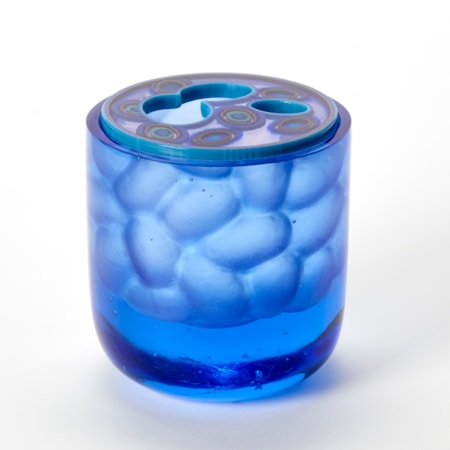 intense rich transparent blue short tubular vessel with smooth exterior and rounded base with a repeat bumped carved interior walls with a round top opening and patterned flat lid with amoeba organic patterned details captured within hand made from cast glass