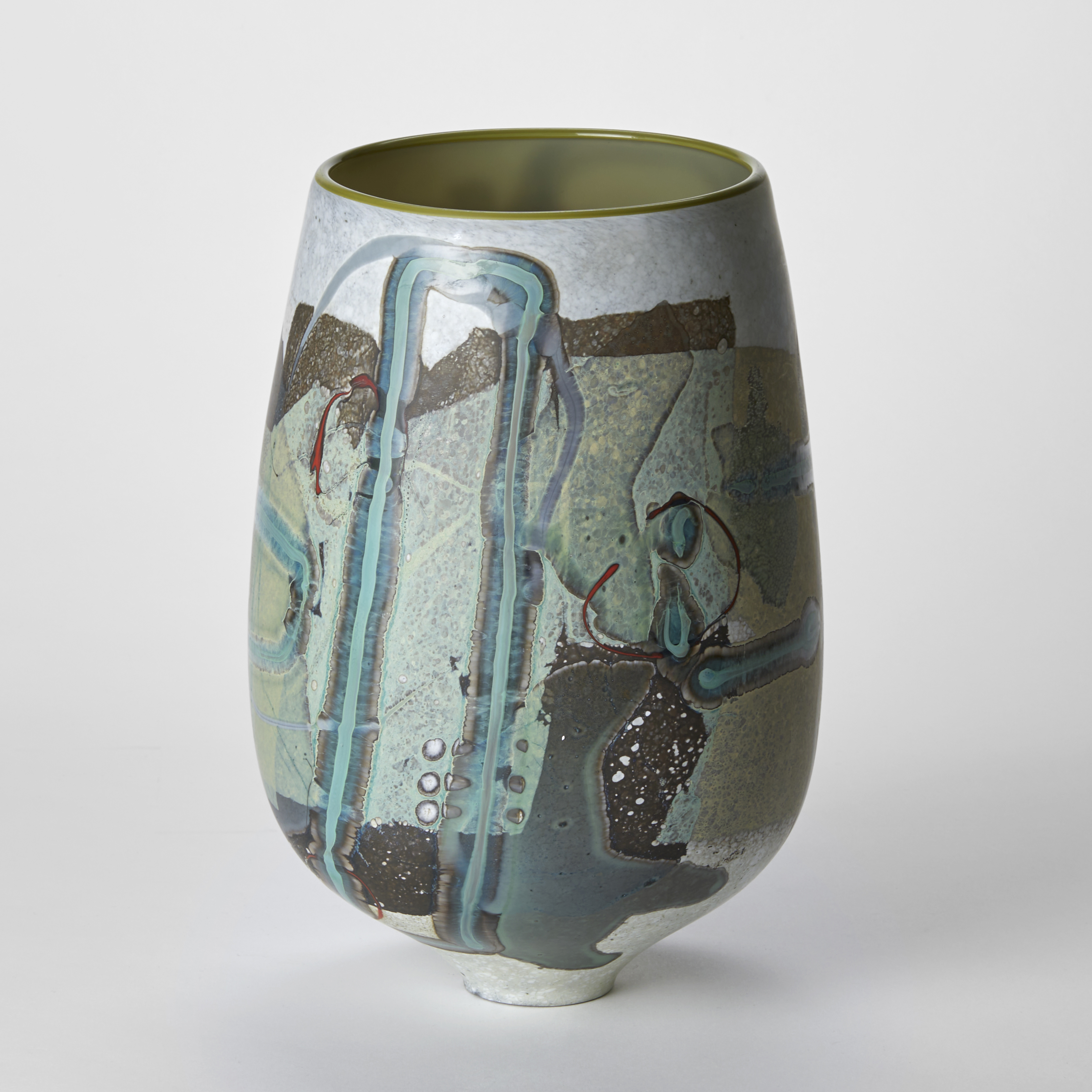 tulip shaped vase with glossy olive interior and a matt exterior covered in abstract patterns and lines in white jade celadon brown green and grey hand made from glass with a narrow elegant foot
