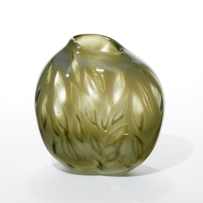 soft round vase in opaque glossy olive green with simple leaf shape clear windows over the surface hand made from blown glass