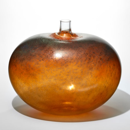fat round bean shaped transparent amber rust and dark brown vessel with a mottled surface pattern and short clear tubular stork thrusting from the top