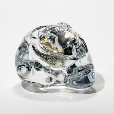 amorphic clear mass with crushed white gold leaf trapped inside hand made from blown and sculptured glass