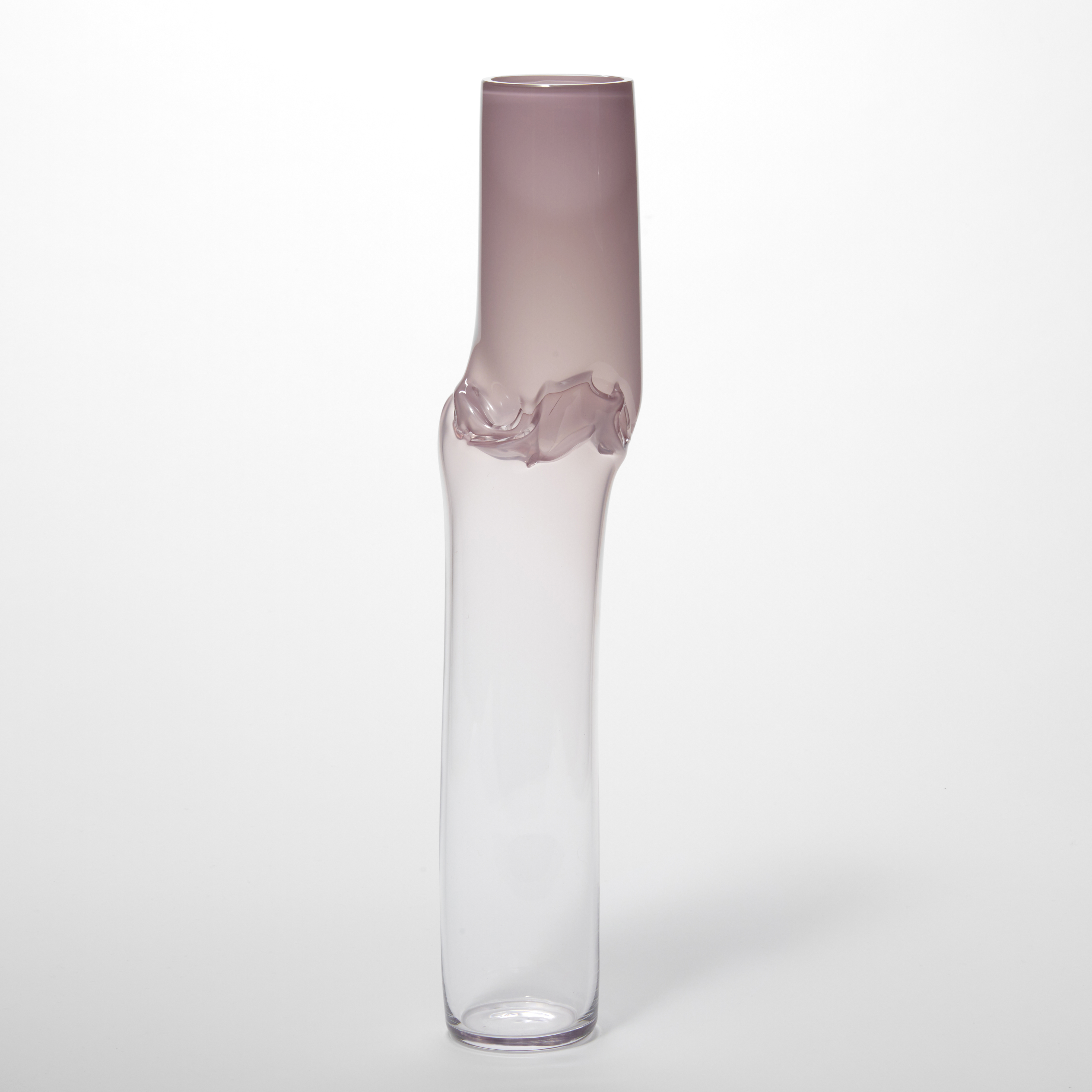 tall cylindrical vessel with a kinked creased section a third from the top in soft pink fading to transparent at the base hand made from glass