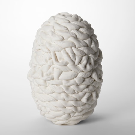 oval white barrel shaped vessel with the appearance as if made from thick ridged irregularly woven chunky wool hand made from parian porcelain