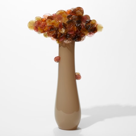 tall tree inspired sculpture with opaque long taupe sleek pear shaped trunk with a diamond shaped cluster of rounded leaves at the top in aubergine pink orange and amber with gold leaf flecks hand made from glass