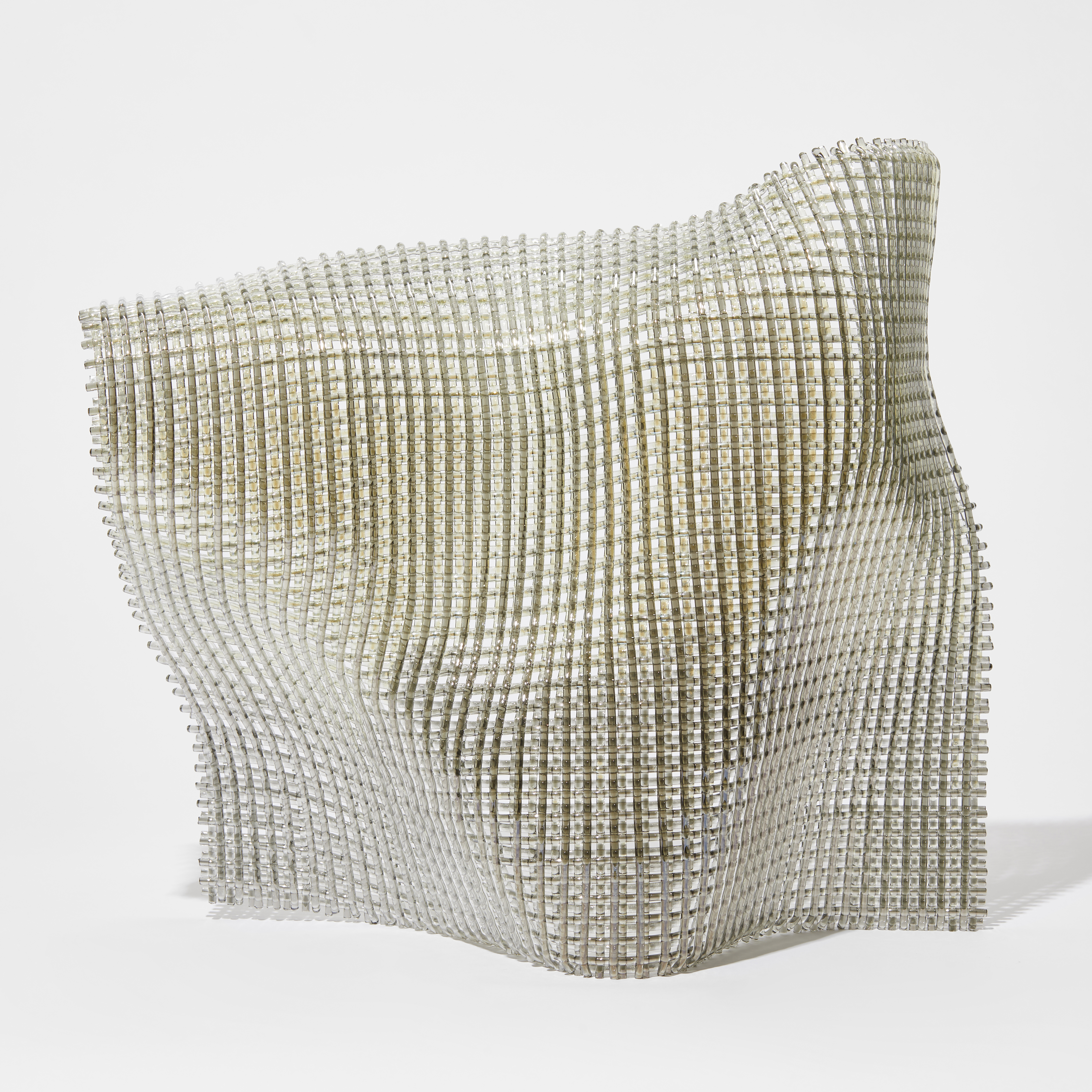 standing undulating draping square sculpture with the appearance of an open weave fabric with a subtle shimmering iridescent finish hand made from fused canes of glass