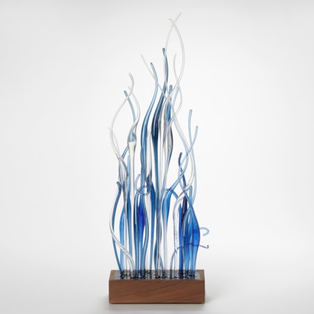low rectangular walnut wood base with a mass of tall wavy transparent canes thrusting from the top in blue and clear hand made from glass
