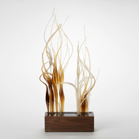 low brick shaped base made from dark walnut wood with two bunched sections of tall entwining curling transparent canes protruding from the top in brown amber and gold hand made from glass