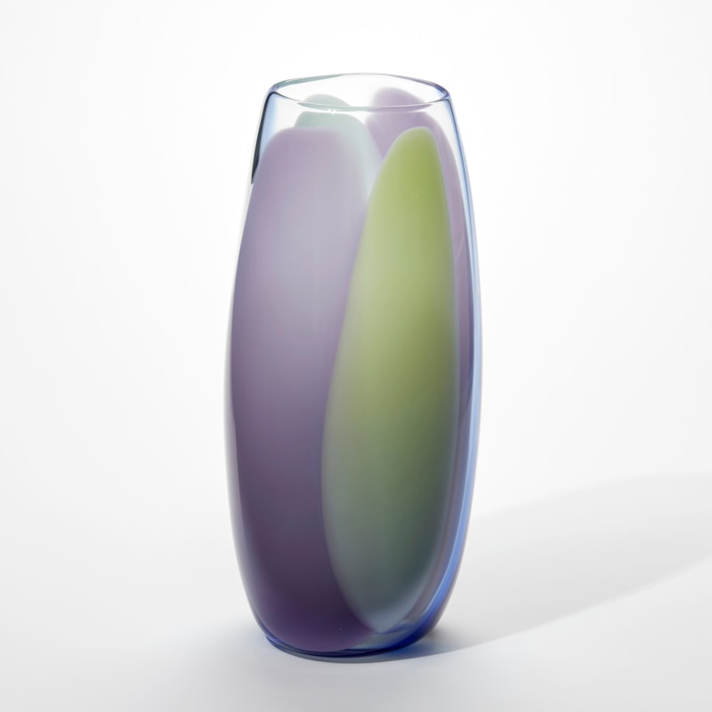 tall transparent soft cylinder vase with slightly bulging sides with vertical singular thick bands of opaque colour in purple turquoise and soft green hand blown from glass