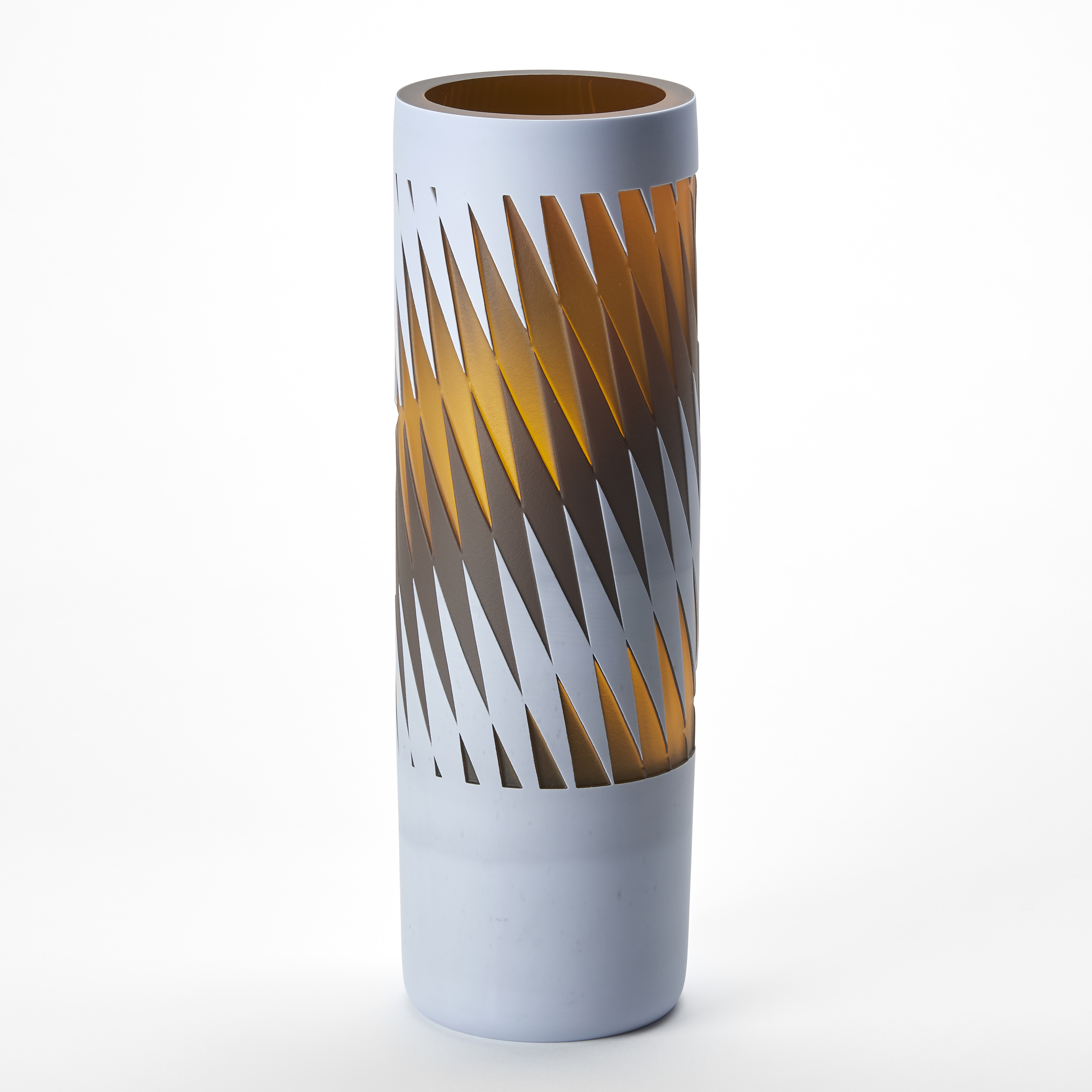 tall tubular vase with a soft matt grey exterior and a graphic geometric stretched repeat diamond pattern in a wide band around the surface in matt brown and translucent amber hand made from glass