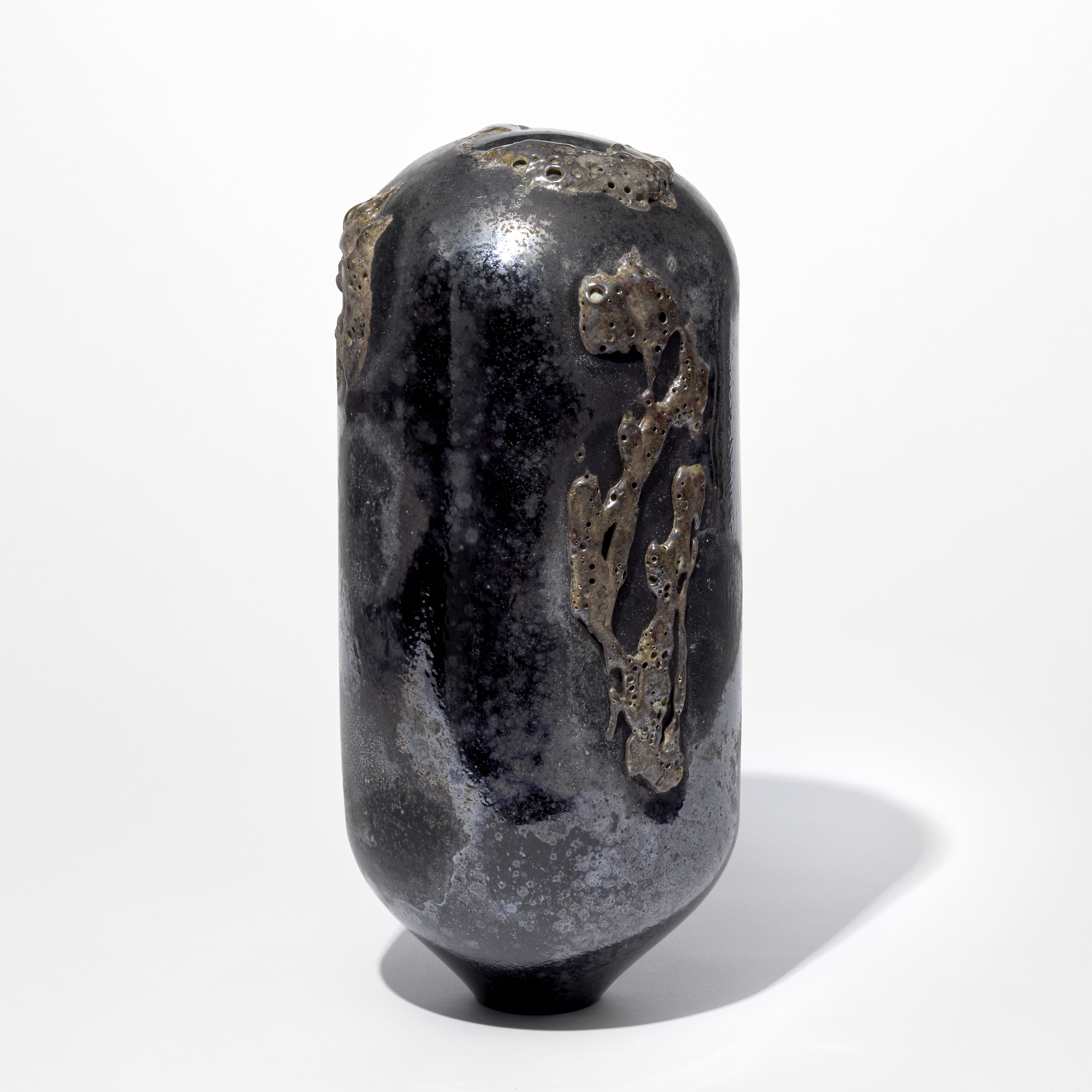 black dark grey and rich aubergine tall rounded standing sculpture with tapered base with intense organic surface texture hand made from glass