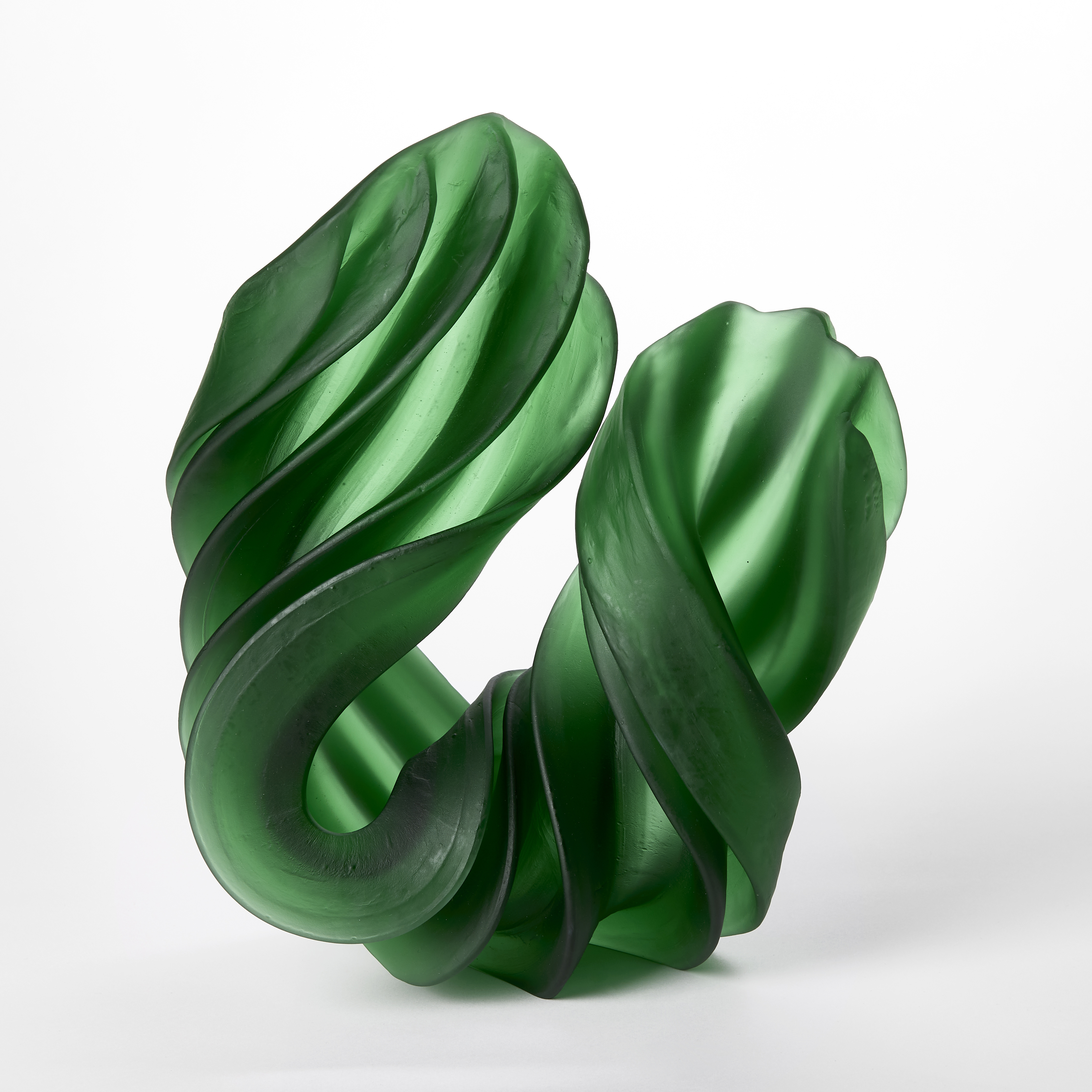 thick semi translucent thick ridged twisting u shaped sculpture in verdant green hand made from cast and sculptured glass