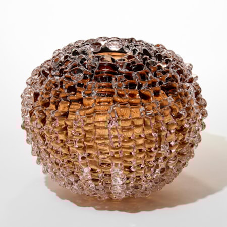 tobacco tea transparent round ball shaped vase with small top opening and the outer surface covered in raised ridged undulating lines hand made from glass