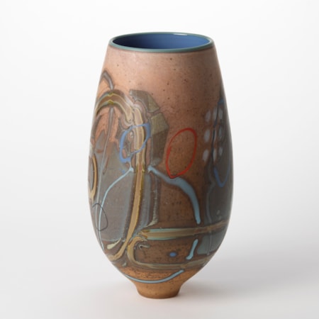 light chocolate coloured teardrop shaped vase with abstract decoration on the surface consisting of lines and dots in ochre red light blue and white with a shiny mid blue interior hand blown from glass