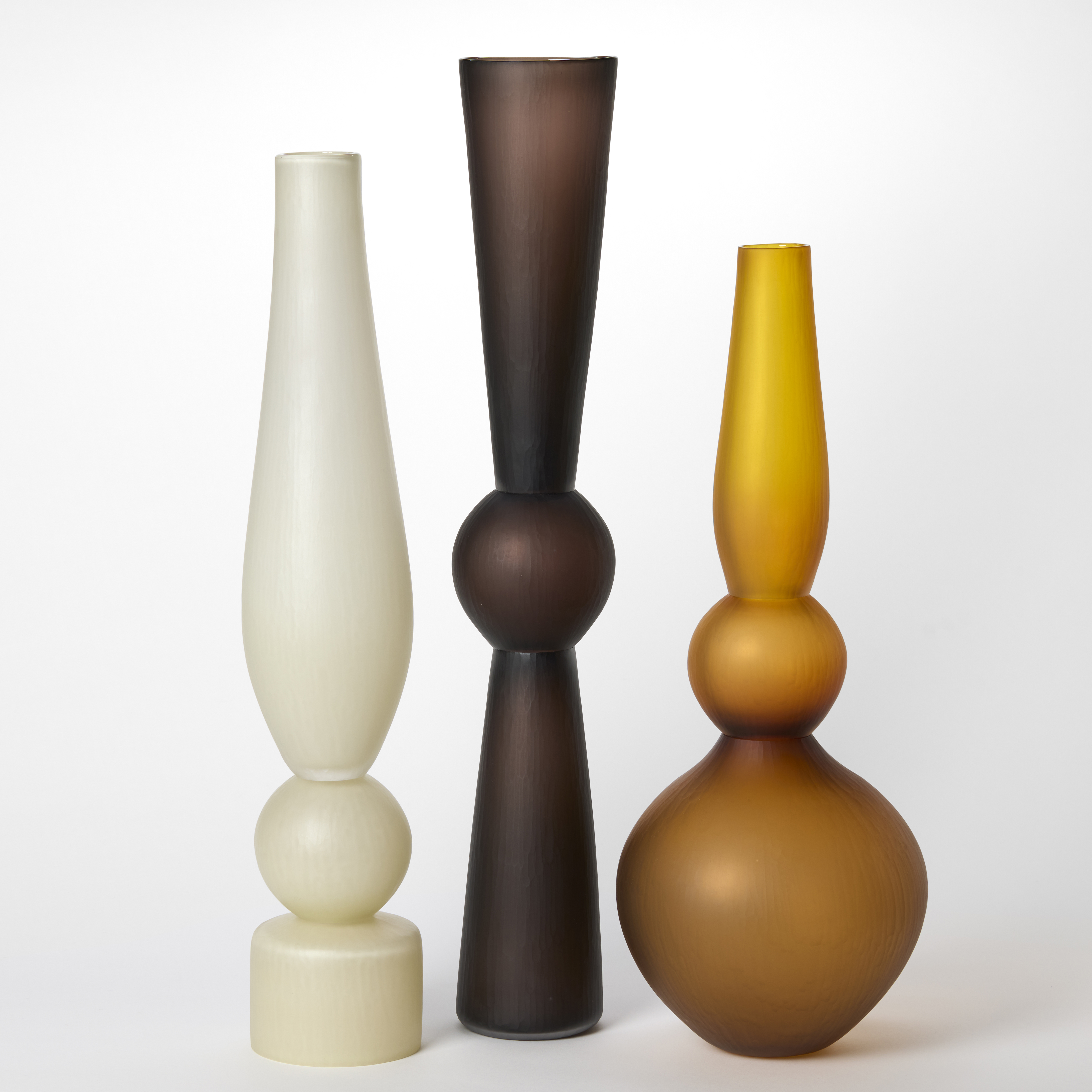 selection of tall minimalist blown glass vases in different colours