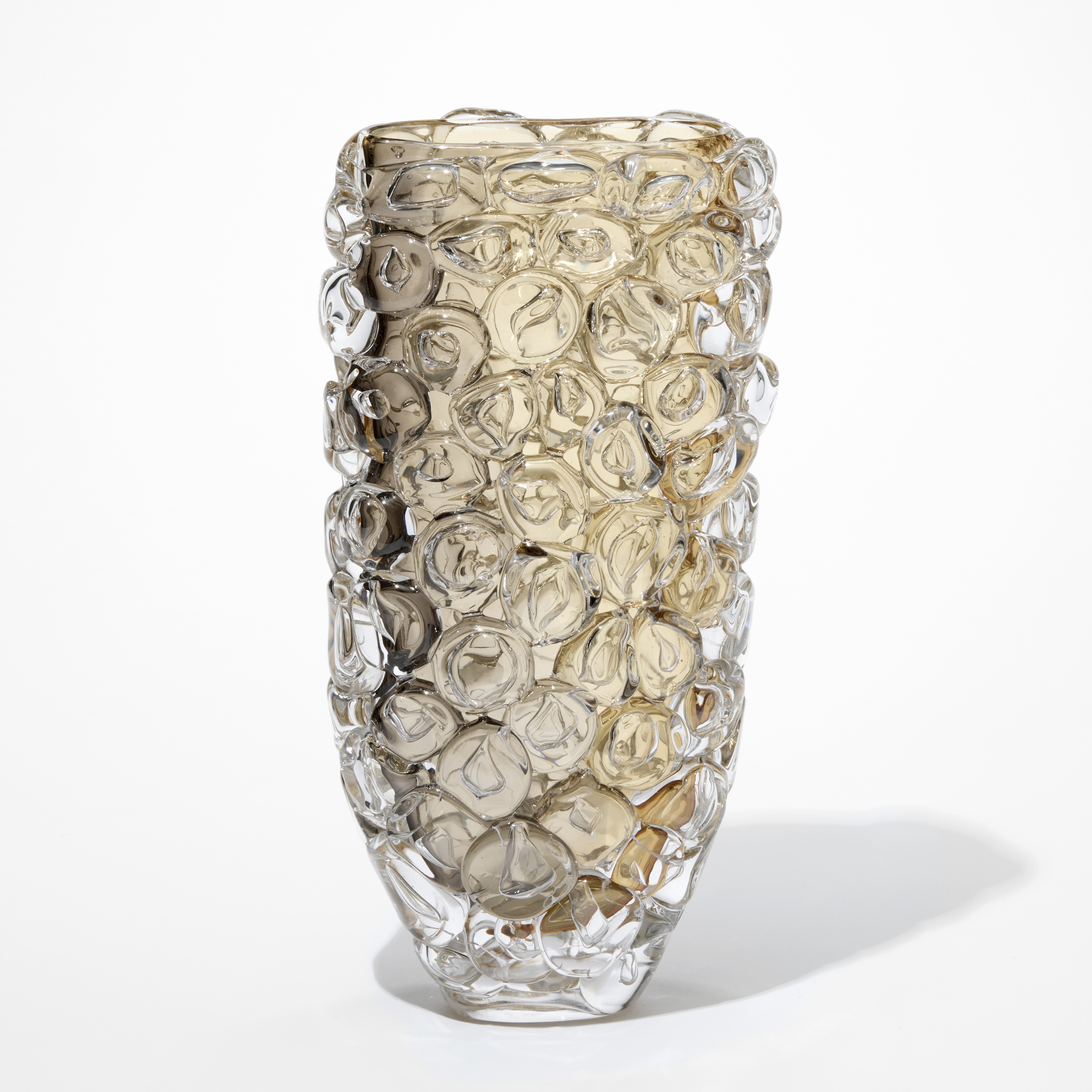 tall transparent soft taupe and warm grey slightly tapering vase covered in oversized bubbles as seen on bubble wrap packaging hand blown from glass