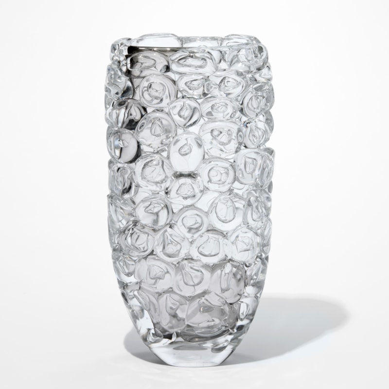 tall transparent clear and grey vase with a slightly flaring shape and outer covered in stocked oversized squashed bubbles hand made from glass