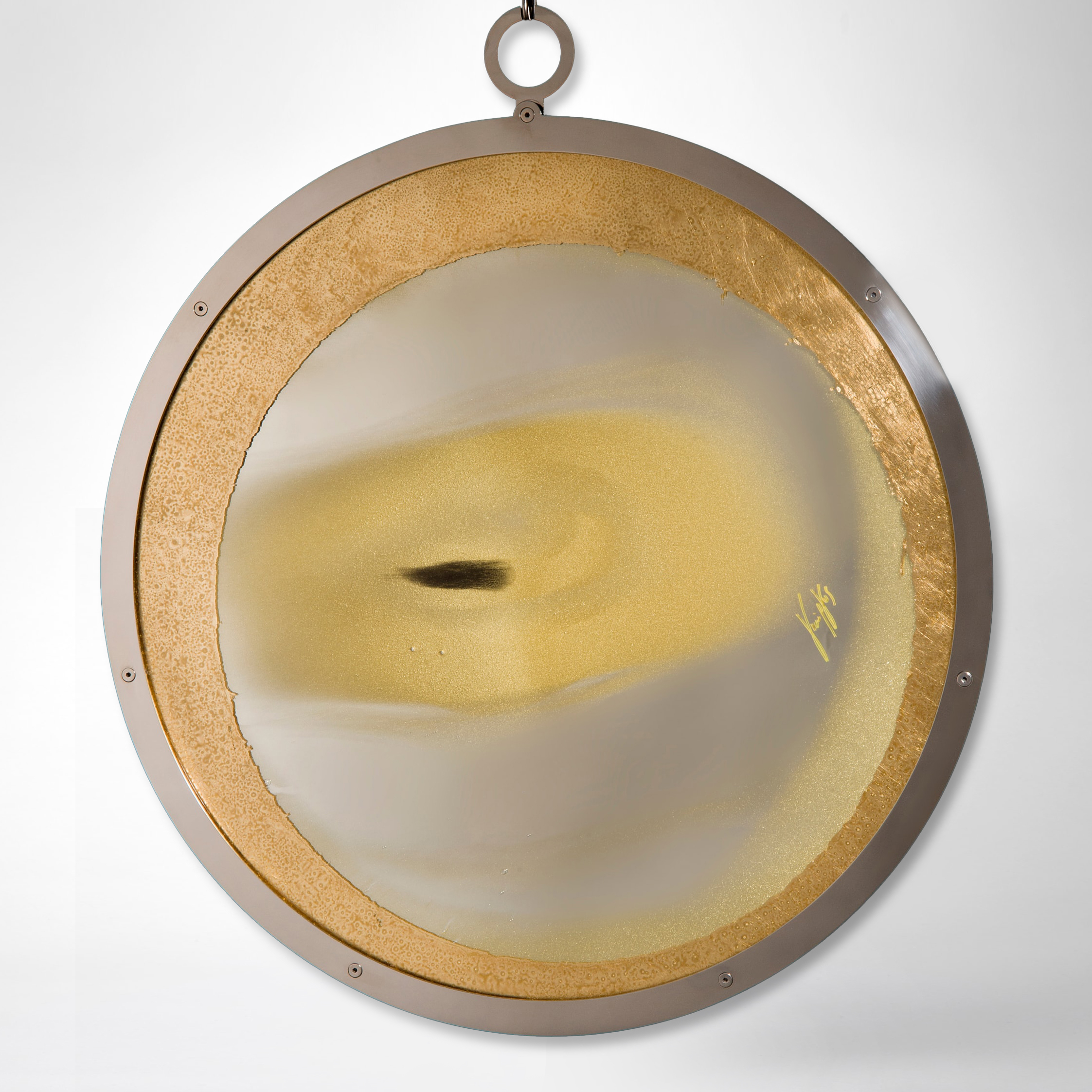 white and gold round art glass sculpture with faint resemblance to an eye on gold chain
