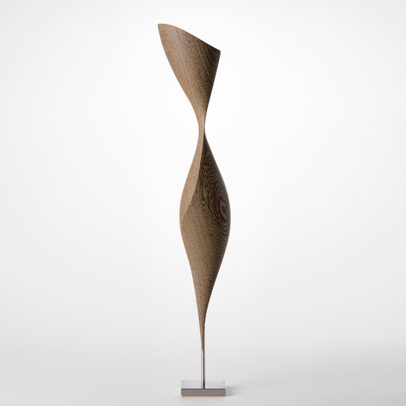 square based simple stainless steel stand holding above an abstract figurative sculpture hand carved from wenge wood
