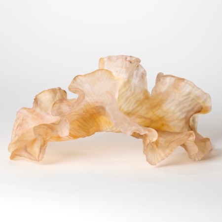 opaque soft amber pink and nude organic sculpture with the appearance of a piece of coral or frilled seaweed hand made from cast glass with a soft satin matt surface and ridged incised underside