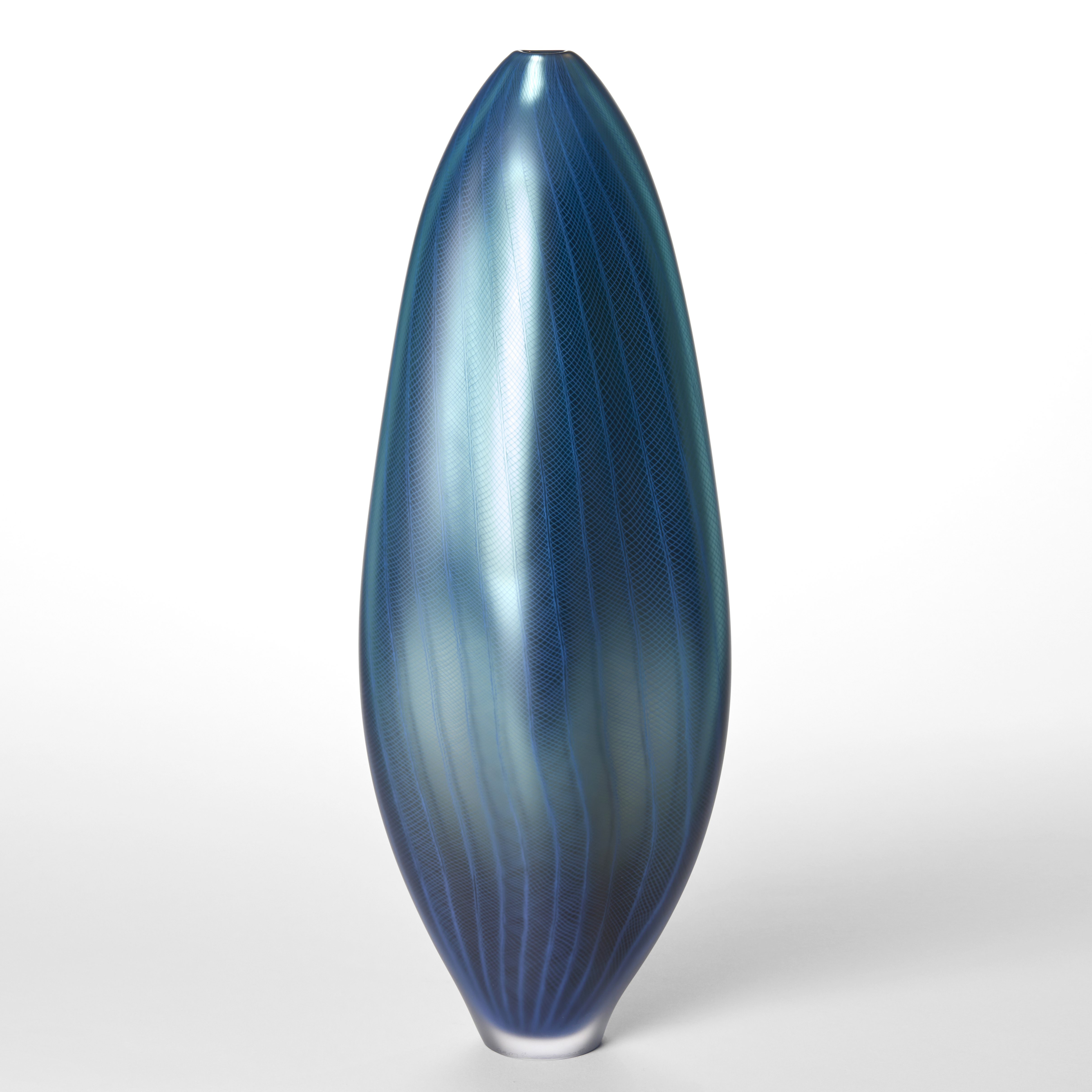 tall amorphic standing fluid form with small top opening and metallic satin surface in a mix of blue colours with a fine repeat lined pattern on the top hand made and blown from glass