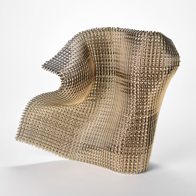 a sculptural artwork made of a grid like structure of glass rods forming a flexible wave like shape that looks as though fabric is frozen mid motion with a shimmering and reflective surface and a complex geometric lattice texture hand made from glass and gold